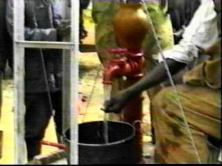 Pumping water by hand.
