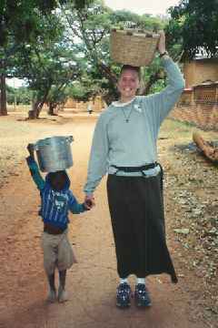 Jill and a kid with buckets