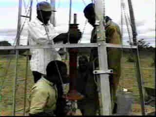 Setting the pump on the well head.